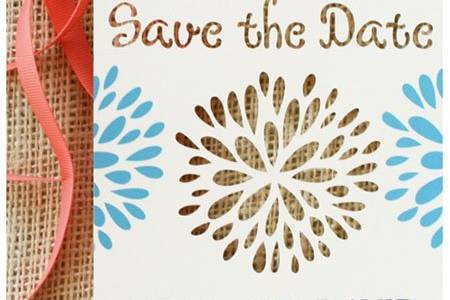 A die cut blossom is featured in the elegant and whimsical save the date card