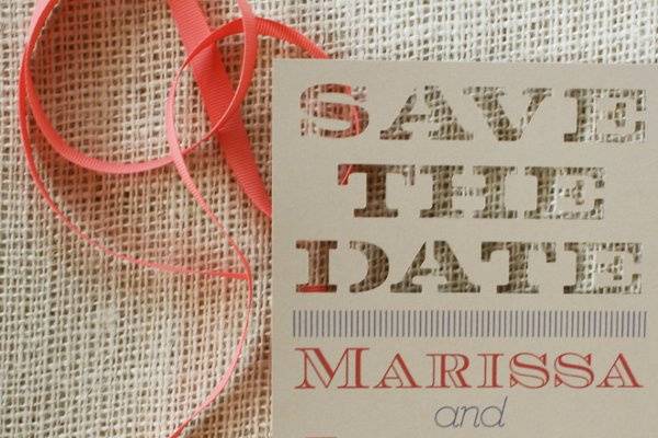 Cut out fonts make this save the date card unique.