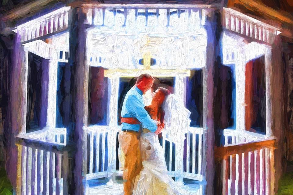 A romantic wedding portrait hand embellished to look like an oil painting