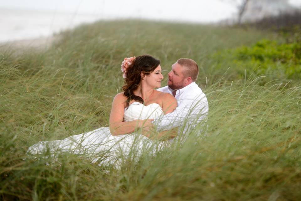 Lost in Love, is the feeling this image conveys as our couple nestle in the sea grasses along the dunes at the House of Refuge in Stuart Florida