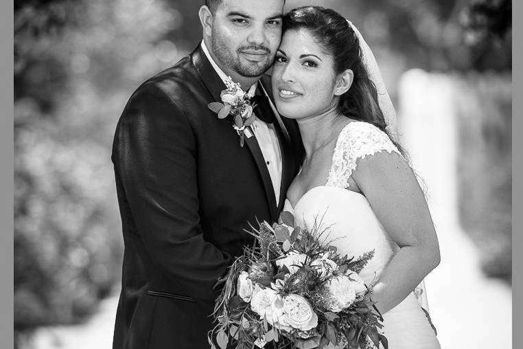 Gorgeous black and white romantic wedding portrait featuring soft lighting coupled with very thin depth of field creating wonderful bokeh in the background.  Two of our specialties