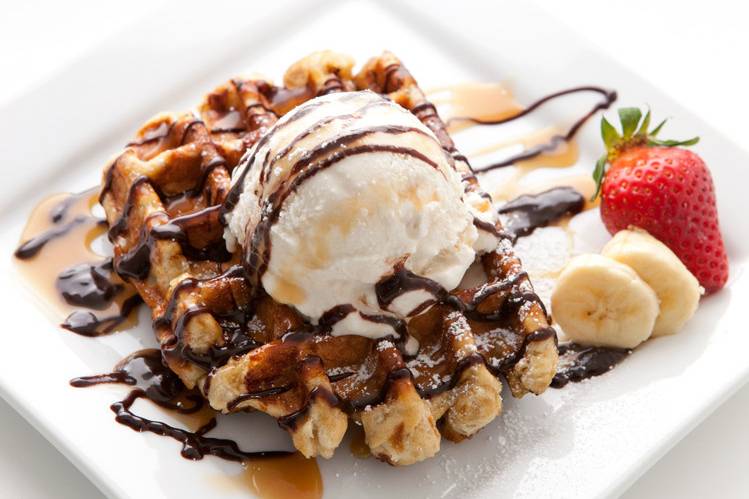 The Ice Cream Waffle Special is one of our most popular menu items. It pairs our signature Liege waffle with Fosselmans ice cream and chocolate and caramel syrup. Additional fruit toppings can be added as well.