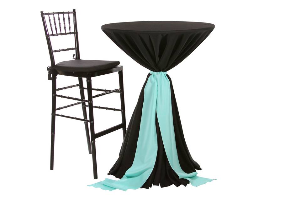 Tall cocktail table with a Chavari Bar Stool