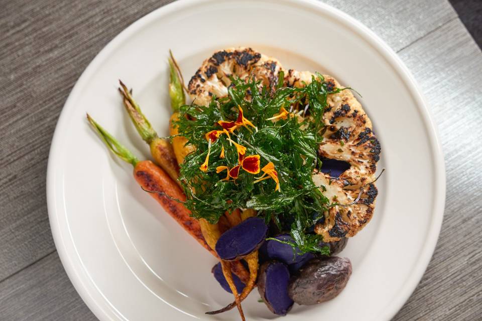We are happy to accommodate your vegan guests.  Entree: cauliflower steak