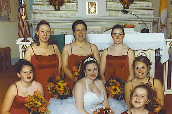 The bride with her bridesmaids holding a bouquet