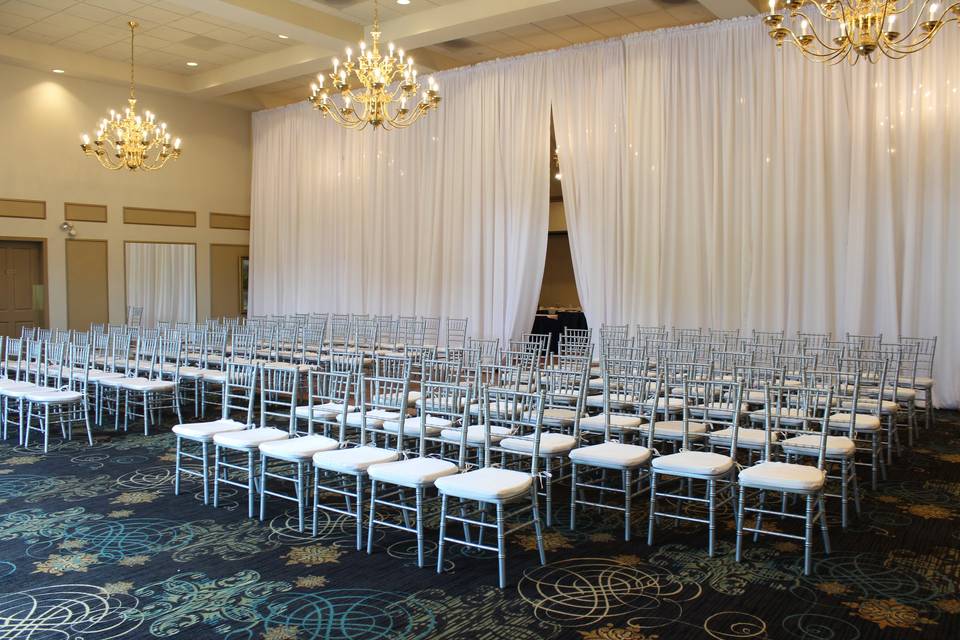 White chair ceremony setup