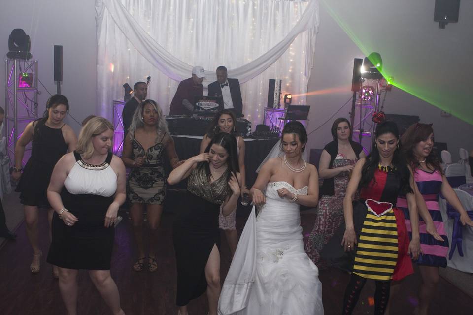 The bride dancing with friends