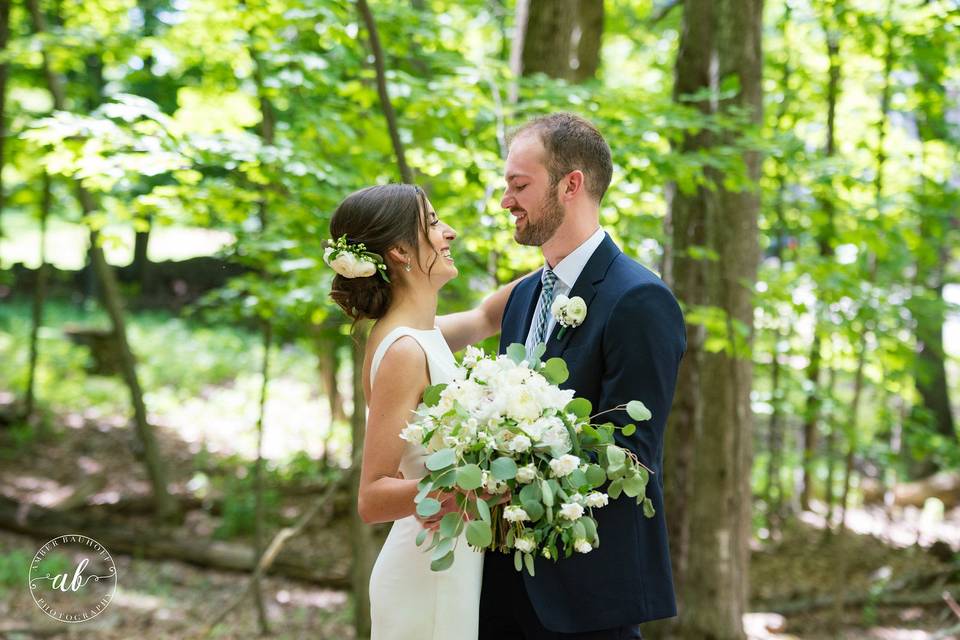 Bride and groom by the trees