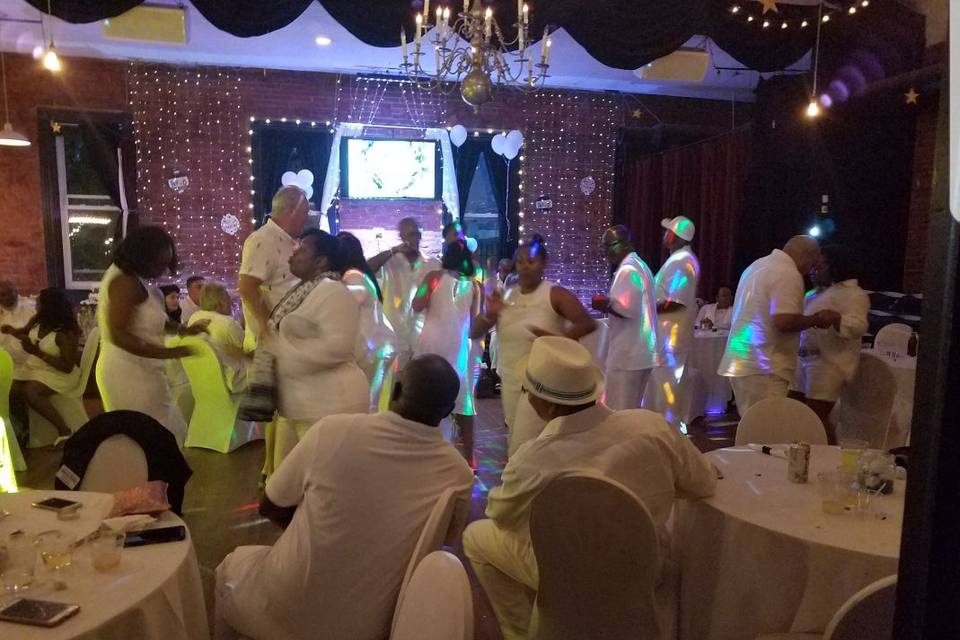 Guests and couples dancing