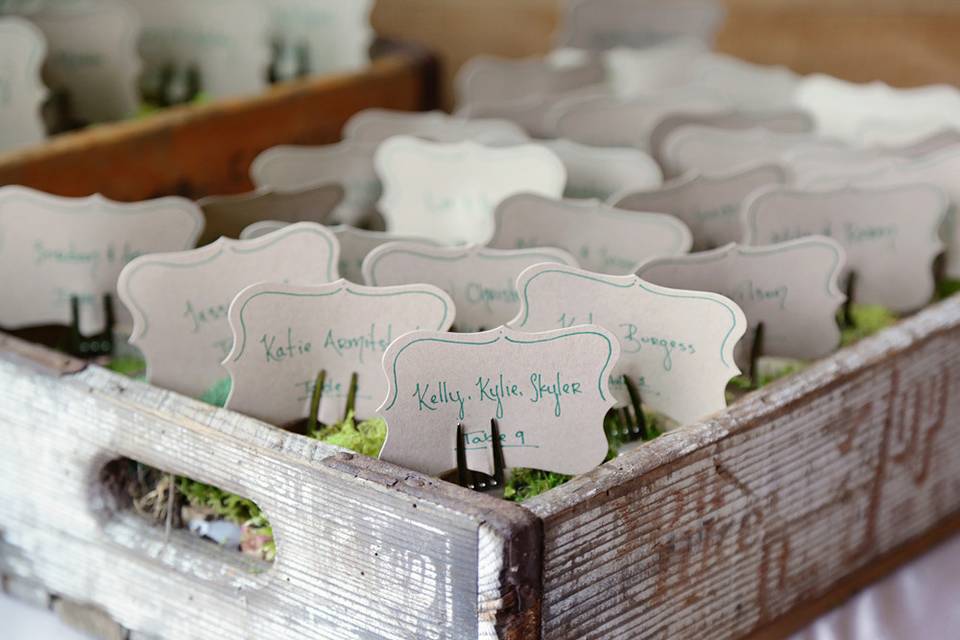 Escort cards in vintage soda crates