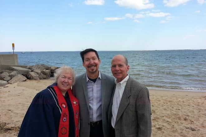 Rev. Alison Hyder with Bill and Mark after their wedding on Provincetown Bay.