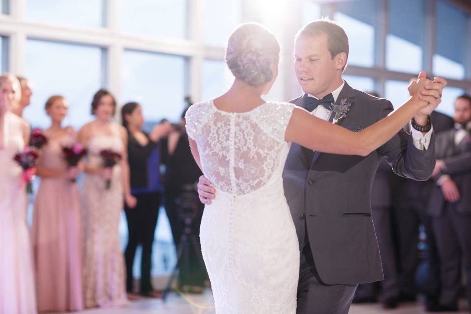 Couple kiss underneath a rainbow