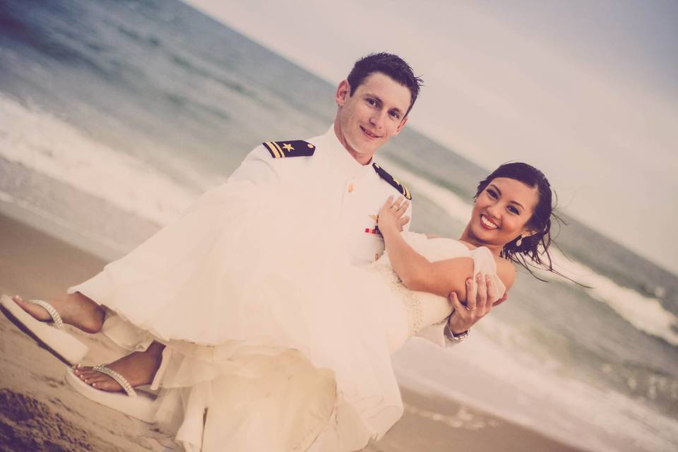 Groom carrying his bride