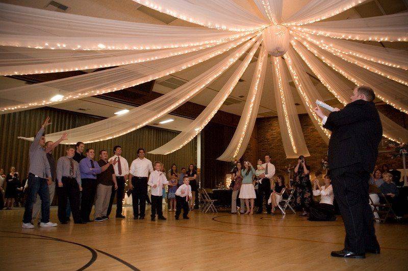 Groom tossing the garter