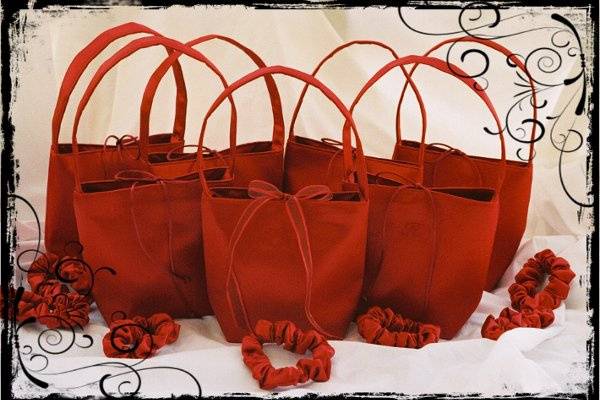 SMALL SQUARE BAG-10 x 10 x 3
Shown here in ruby red matte satin with red embroidery & ribbon bow.
Single handle, Fully lined.