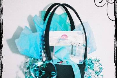 SQUARE MINI BAG-approx. 7 x 7 x 3 shown here in black with turquoise lining, ribbon bow, embroidery, tissue, curling ribbon & star garland.
The mini bag makes an excellent gift bag...and then your bridesmaids, wedding party, flower girl, etc. can use it as a purse:)