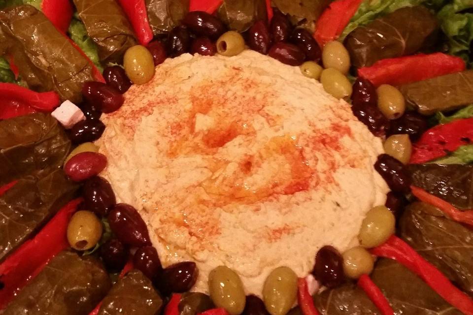 Hummus with Stuffed Grape Leaves and Olives