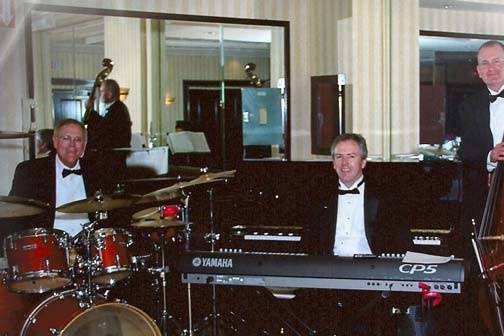 The Happiness Jazz Trio in tuxes.