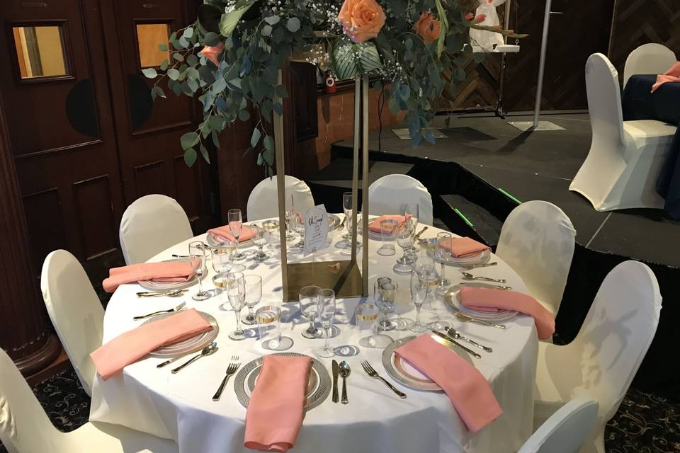 Table setting and raised floral centerpiece