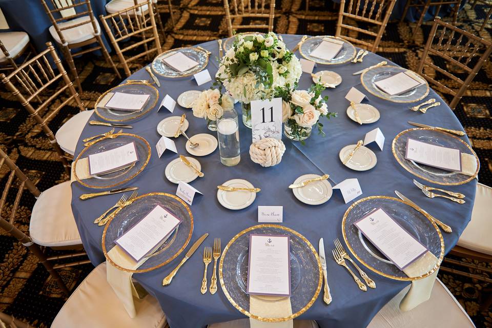 Blue linens and gold foiled plates