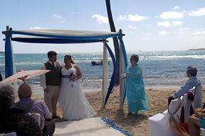 Shannan and Aaron's beautiful sea glass arch and aisle for their beach wedding in St. Thomas.
