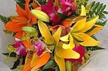 Garden style bouquet in bright colors for your St. Thomas wedding. Boutonniere included.