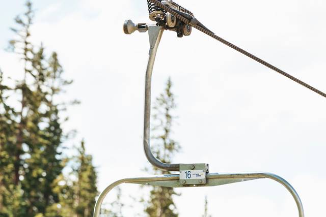 Guest riding the chairlift