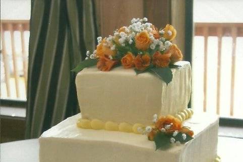 3-tier cake with pink ribbons