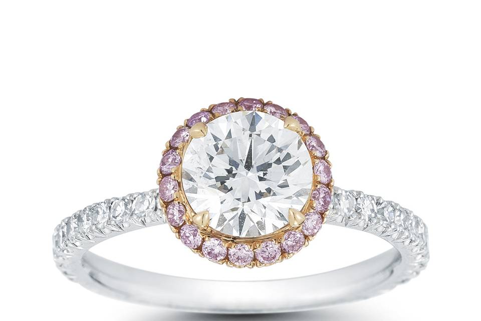 This is our InLove setting featuring a round brilliant Forevermark diamond!  The band is platinum with a rose gold halo with fancy pink diamonds.  Allows a wedding band to sit perfectly flush!