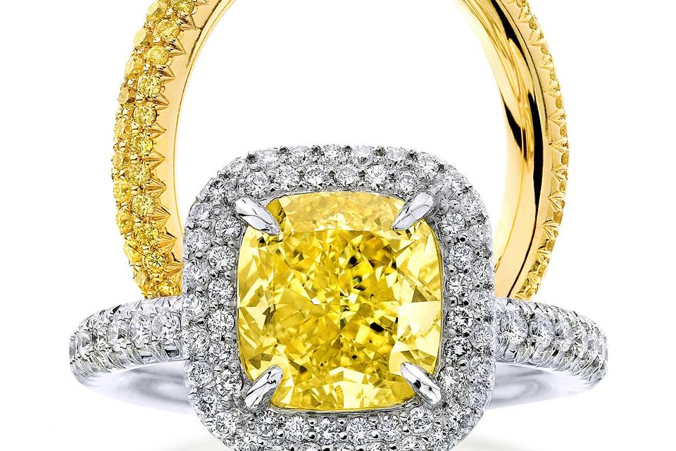 The Double Row Cushion LarisaThis unique beauty features a fancy intense yellow cushion cut diamond in a micro pave two row Larisa setting. This ring is available in stone sizes, 1ct. and above.