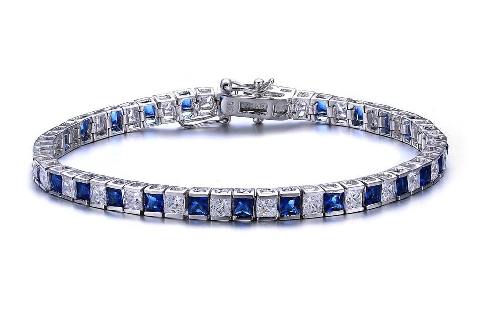 Blue and White BraceletAlternating blue and white crystals create a playful pattern on this sterling silver and rhodium coated bracelet.