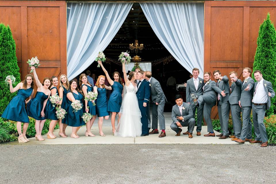 The couple with the bridesmaids and groomsmen