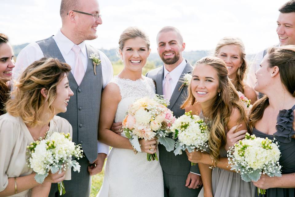 The couple with the bridesmaids and groomsmen