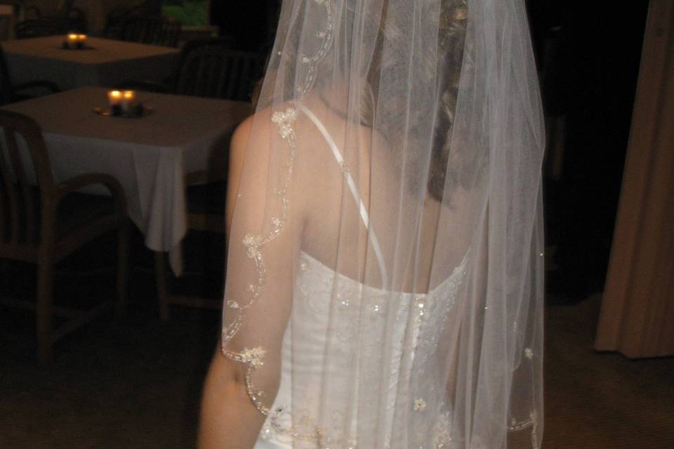 We worked tirelessly with our real bride to find a beaded edge veil in our collection that would coordinate best with her lovely wedding dress and this one matched her dress perfectly!  She was thrilled!