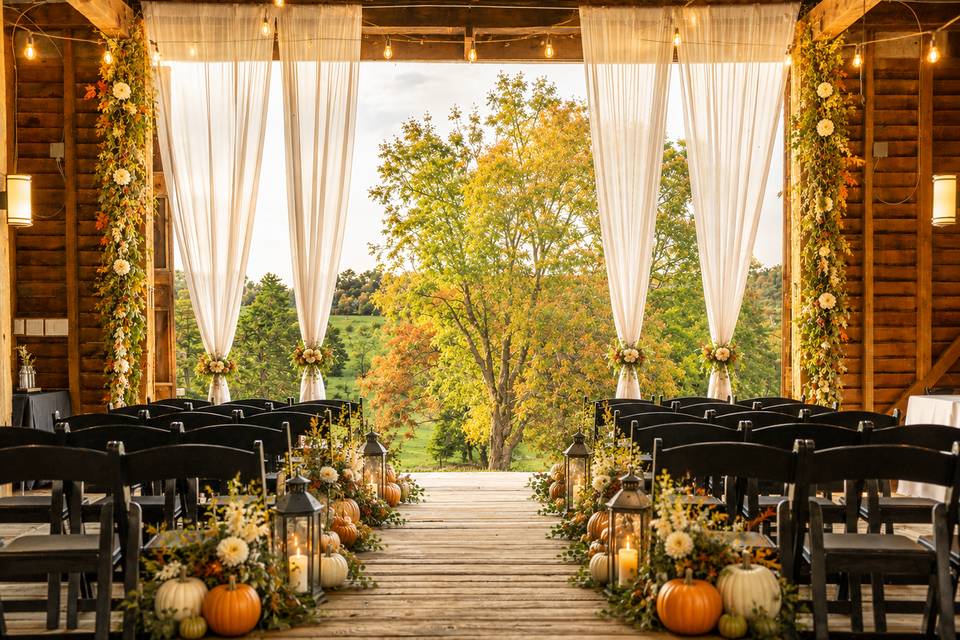 Indoor fall barn ceremony