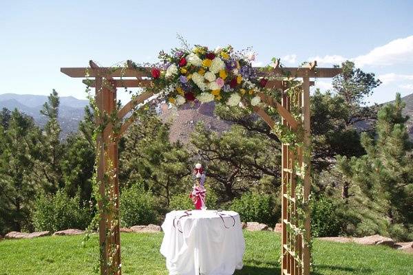 Our rental lattice arch is 7' tall, 6' wide, and 4' deep.  It creates a beautiful setting for you, the groom, and the officiant to stand UNDER, not in front, so your decor is not hidden!