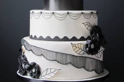 Royal Wedding Inspired: This 4 tiered cake is fondant covered in white, has black fondant 