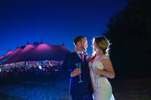 Newlyweds outside the tent