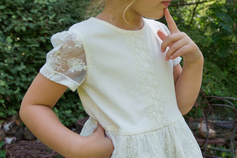 Natasha Girls Dress - Magic moments call for an enchanting dress with equal measures of innocence and elegance. Cotton/nylon tulle shell is dressed up with cotton floral embroidery and a scalloped hem that falls just below the cotton shantoon lining.