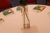 Red hydrangea centerpieces with gold accents for this December reception.