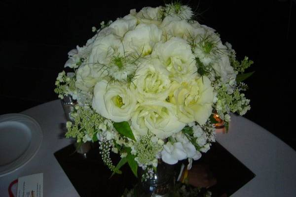 Bridal bouquet featuring lisianthus, hydrangeas, sweet peas and nigella.