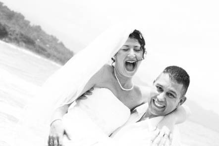 Bride and her groom are all smiles just minutes after their beach wedding ceremony in Costa Rica.