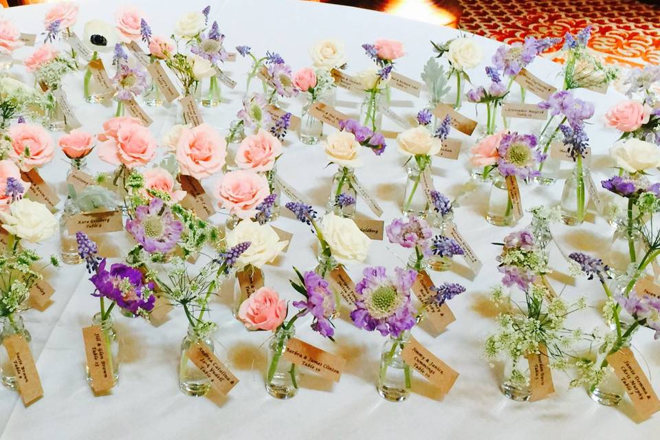 Each guest received a mini bottle with a flower and their escort card to add to their guest tables!
