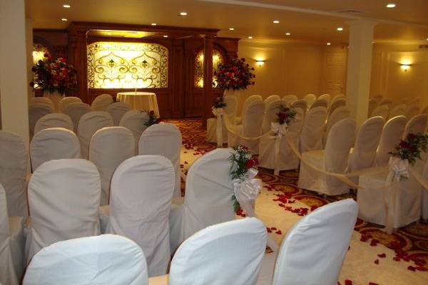 Wedding ceremony flowers designed in red roses at The Merion by Stein Your Florist Co.