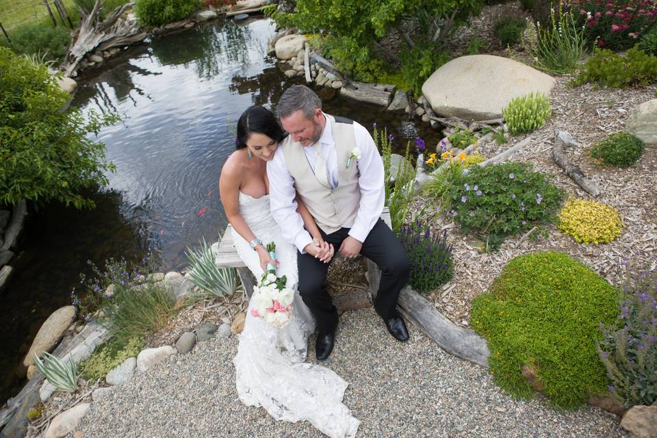 Bride and groom with fish pond