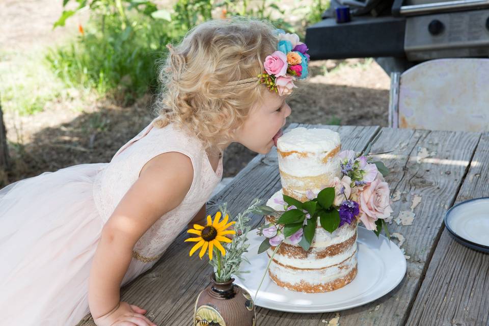 Flower girl sneaking cake