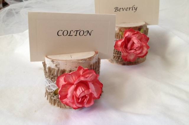 The coral color of this rose is divine. We added burlap and lace, and we think it's the perfect country touch to your table. It will bring out the colors of your special day. Perfect for a rustic barn wedding. This listing is for a set of 10 natural birch wood place card holders for $35.00Each birch wood holder is embellished with a 2 inch coral rose and lace ribbon.They are 2 inches tall, and approximately 2 - 2 1/2 inches wide. Each holder has a 3/8 inch slot on the top which holds the place card nicely.Use these at weddings, rehearsal dinners, baby showers, and really any party event that you want some additional sparkle to your table. Mixing and matching styles is a beautiful table design statement.if you don't see what you are looking for, just send us a message and we are happy to create that special look for you.Keep it rustic chic!Tutti Rose DesignsBe sure to visit www.etsy.com/shop/tuttirosedesigns to see our collection.