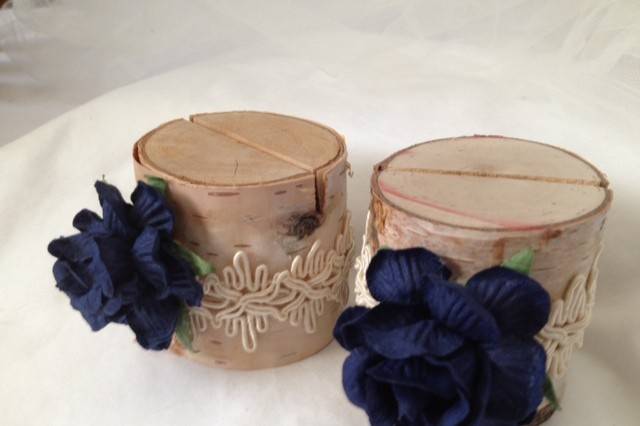 These are a deep navy blue - perfect for a rustic barn wedding or a beach wedding. They are so pretty on the table and they do a fantastic job bringing out the flower colors in your centerpiece.This listing is for a set of 10 natural birch wood place card holders for $35.00Each birch wood holder is embellished with a 2 inch navy rose and a natural lace ribbon. They are a beautiful compliment to the decorations on your tables.They are 2 inches tall, and approximately 2 - 2 1/2 inches wide. Each holder has a 3/8 inch slot on the top which holds the place card nicely. Each piece is hand crafted so no two are alike!Use these at weddings, baby showers, and really any party event that you want some additional sparkle to your table. if you don't see what you are looking for, just send us a message and we are happy to create that special look for you.Keep it rustic chic!Tutti Rose DesignsBe sure to visit www.etsy.com/shop/tuttirosedesigns to see our entire collection.