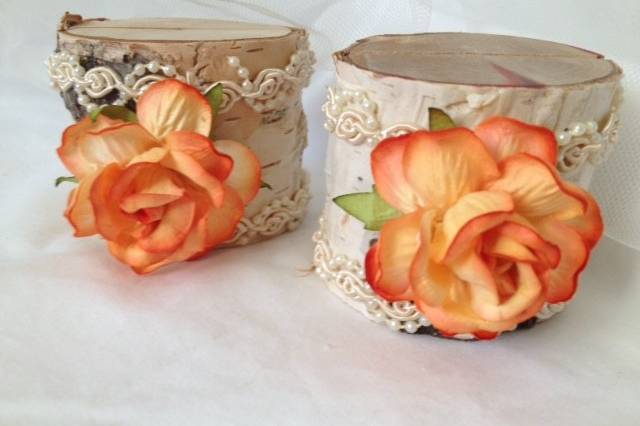Peach Elegance is the perfect way to describe these lovely, sweet place card holders. Perfect for a rustic barn wedding. They are so pretty on the table and they do a fantastic job bringing out the flower colors in your centerpiece.This listing is for a set of 10 natural birch wood place card holders for $35.00Each birch wood holder is embellished with a 2 inch peach rose and pearl and lace ribbon. They are a beautiful compliment to the decorations on your tables.They are 2 inches tall, and approximately 2 - 2 1/2 inches wide. Each holder has a 3/8 inch slot on the top which holds the place card nicely. Use these at weddings, rehearsal dinners, baby showers, and really any party event that you want some additional sparkle to your table. if you don't see what you are looking for, just send us a message and we are happy to create that special look for you.Keep it rustic chicTutti Rose DesignsBe sure to visit www.etsy.com/shop/tuttirosedesigns to see our entire collection.