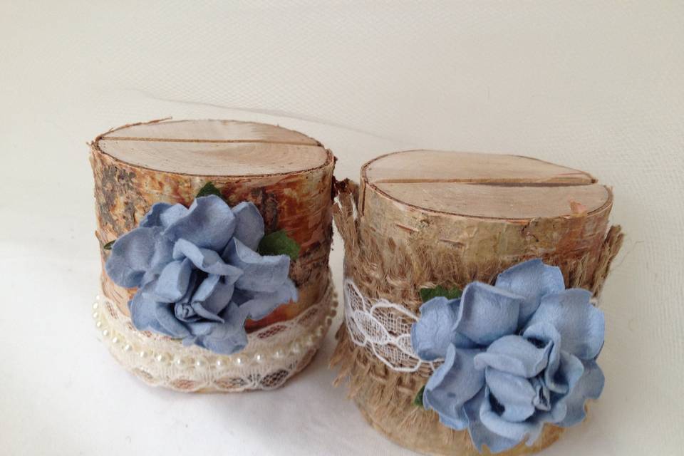 These remind me of the clear blue sky. So lovely, and what a wonderful addition to your wedding.This listing is for a set of 10 natural birch wood place card holders for $35.00Each birch wood holder is embellished with burlap and lace or pearls and lace ribbons. They are a beautiful compliment to the decorations on your tables. They are 2 inches tall, and approximately 2 - 2 1/2 inches wide. The flowers are 1 1/2 inch wide. Each holder has a 3/8 inch slot on the top which holds the place card nicely. Each piece is hand crafted so no two are alike!Use these at weddings, baby showers, and really any party event that you want some additional sparkle to your table. Mixing and matching styles is a beautiful table design statement.if you don't see what you are looking for, just send us a message and we are happy to create that special look for you.Keep it rustic chic!Tutti Rose Designstuttirose@yahoo.comBe sure to visit www.etsy.com/shop/tuttirosedesigns to see our collectio